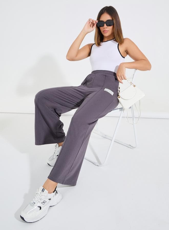 High Waisted Wide Leg Pintuck Jogger With Badge Detail