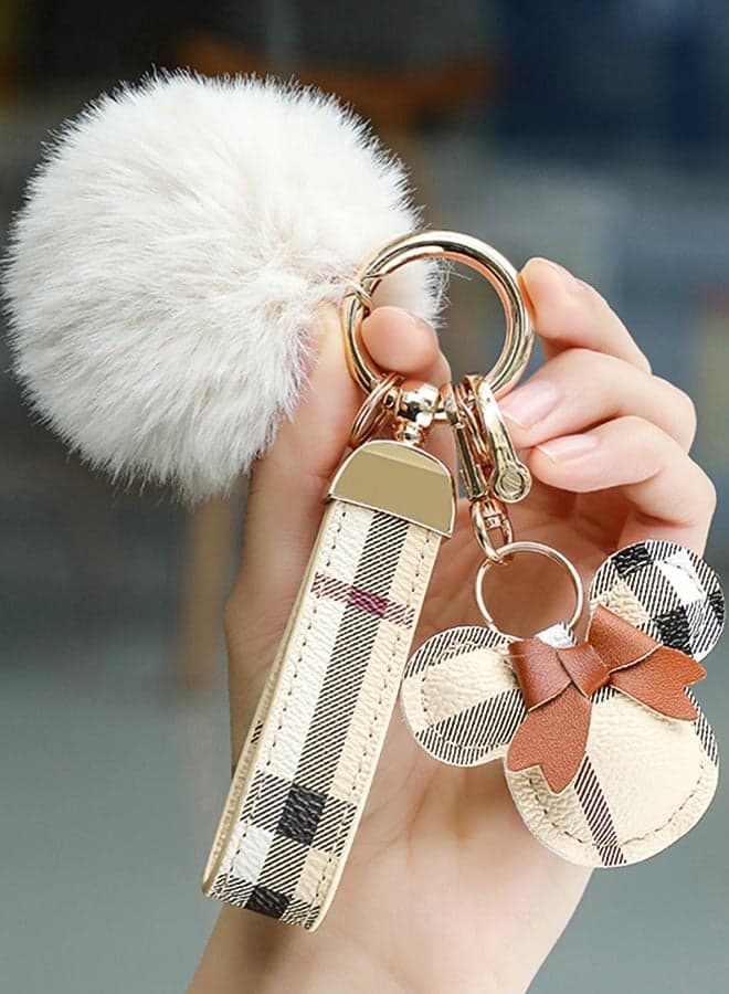 Elegant metal and plaid leather keychain set with a fluffy faux fur pom-pom and Mickey charm. Stylish keychain for women, featuring golden accents and multiple key rings for functionality. Includes a plaid leather strap and matching accessories, making it a perfect gift choice.