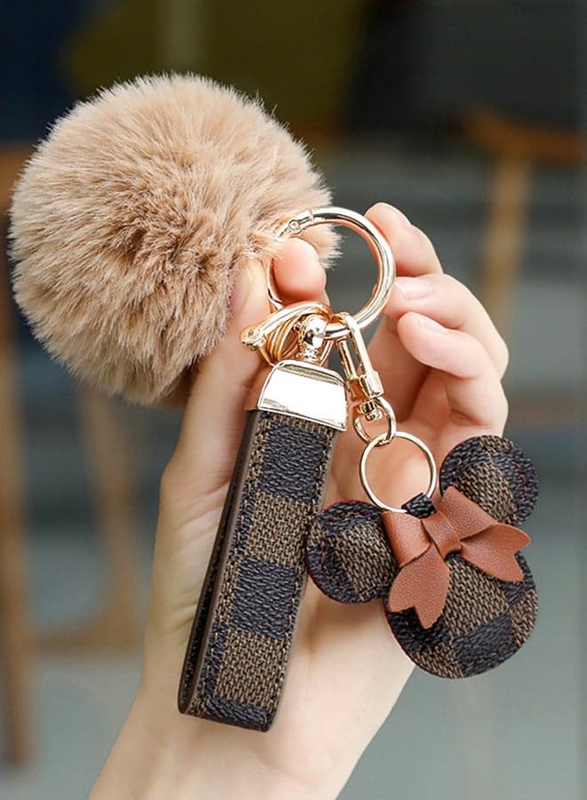 Dark brown keychain with elegant fluffy fur for women , A great option as a gift . Plaid leather and golden metal keychain includes matching accessories