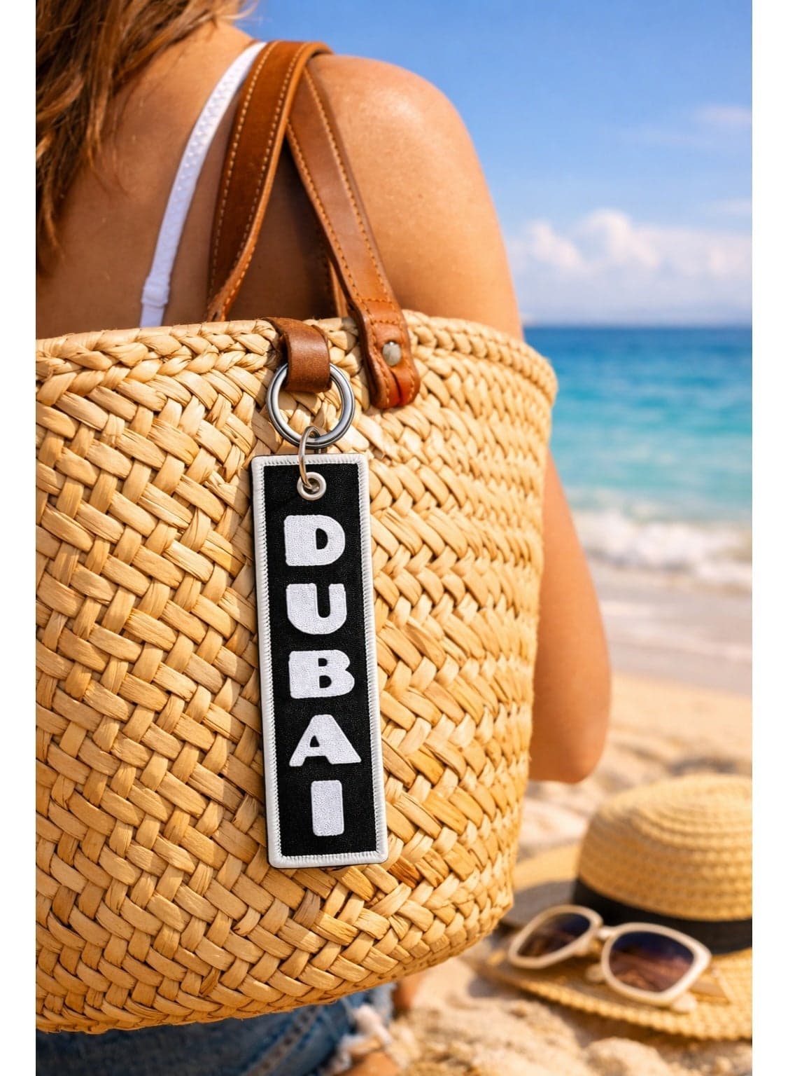 Pack of 2 embroidered Dubai keychains featuring bold design, long-lasting stitching, and secure metal rings—perfect accessory for keys, luggage, and gifts.Black