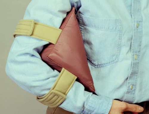Small elbow or knee orthosis. 9” base 5” width 90° angle; color: teal