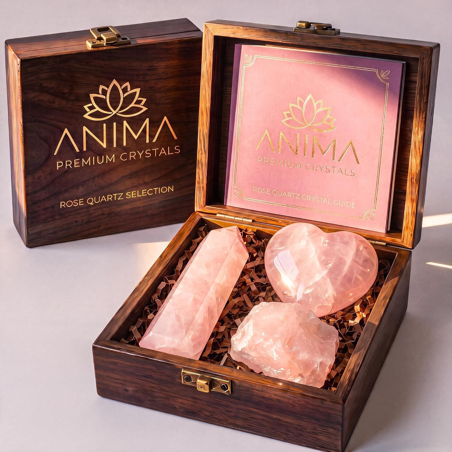 Anima® Rose Quartz Crystal Set for Love, Self-Care & Connection | Elegant wooden gift box with rose quartz tower, raw crystal and carved heart, plus a detailed guidebook